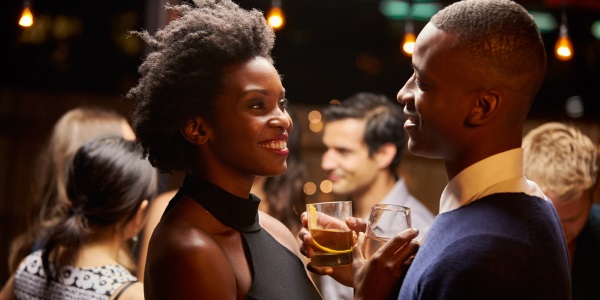 Couple flirting at bar